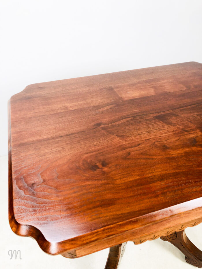 Steeped in history and handcrafted charm, this antique Eastlake parlor table, circa 1890, invites timeless sophistication into your home. Constructed from rich solid sapele mahogany and warm walnut.