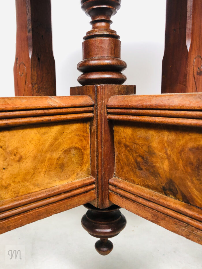 Steeped in history and handcrafted charm, this antique Eastlake parlor table, circa 1890, invites timeless sophistication into your home. Constructed from rich solid sapele mahogany and warm walnut,